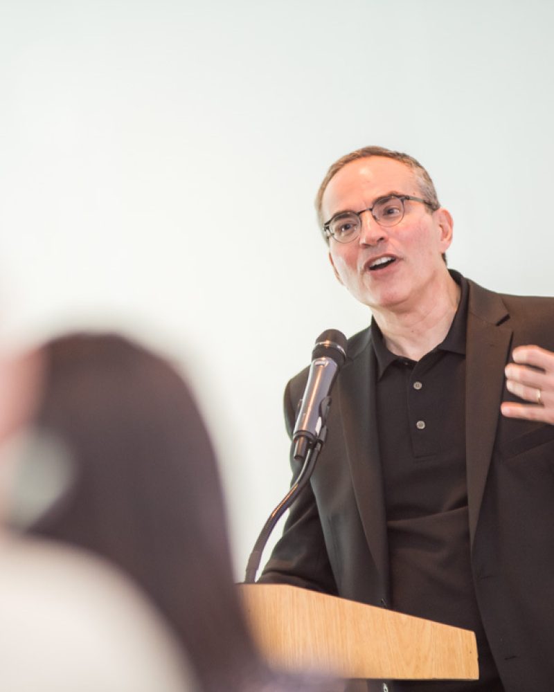 A picture of Mark Levy speaking